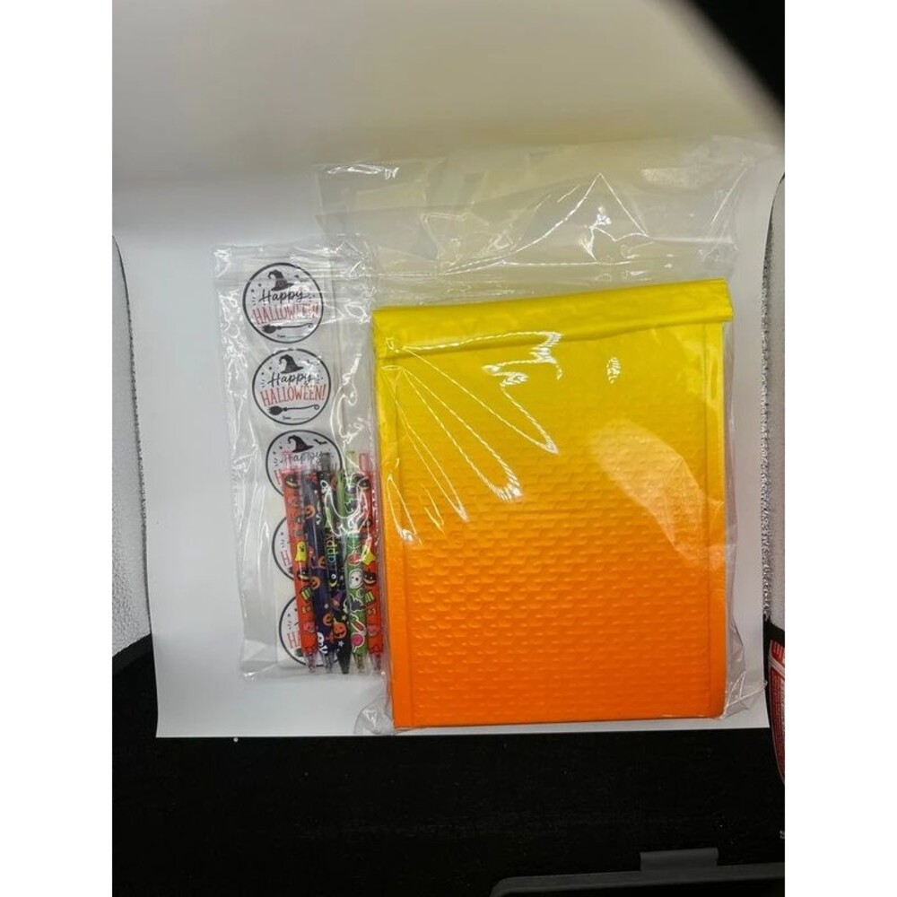 10 pack of yellow/Orange ombré matte bubble mailers with 10 Halloween stickers a